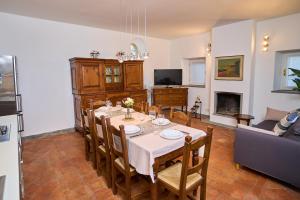 a dining room with a table and a couch at [Villa Privata] Vista Mare - in Portovenere in Fezzano