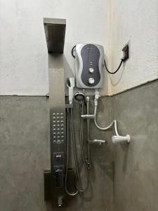 a public bathroom with a phone in a wall at Water Angel Villa in Kamburugamuwa
