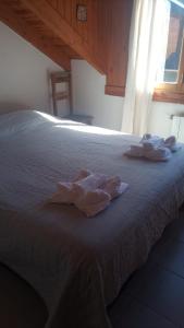 Una cama o camas en una habitación de Hospedaje de Ensueño SMA