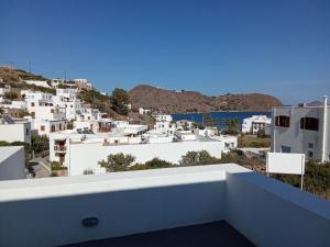 a view of the city from the balcony of a house at kominoshouses in Skala