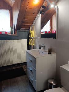 a bathroom with a sink and a toilet at Harmony House in Salvan