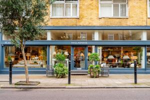 a store front of a building with chairs in front at The Marylebone Goldmine in London