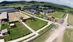 an aerial view of a building with a large field at Hotel Rozálka in Pezinok