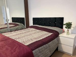 A bed or beds in a room at Spacious House in Hertfordshire