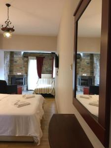 Posteľ alebo postele v izbe v ubytovaní Tasia Mountain Hotel