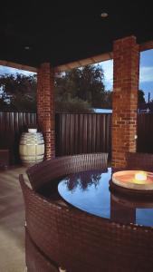 a swimming pool in a backyard with a brick fence at The BnB filled to the brim with character & charm! in Dubbo