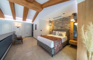 Postel nebo postele na pokoji v ubytování Batıhan Vadi Hotel + 37 fotografií