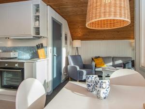 a kitchen and living room with a table and chairs at 5 person holiday home in Lemvig in Lemvig
