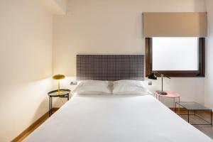 Postel nebo postele na pokoji v ubytování Hostal Pichorradicas