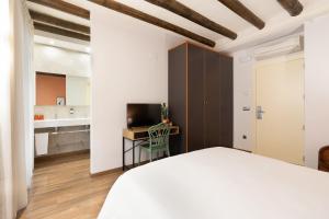 Postel nebo postele na pokoji v ubytování Hostal Pichorradicas