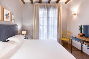Postel nebo postele na pokoji v ubytování Hostal Pichorradicas