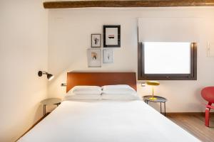 Postel nebo postele na pokoji v ubytování Hostal Pichorradicas