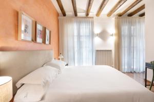 Postel nebo postele na pokoji v ubytování Hostal Pichorradicas