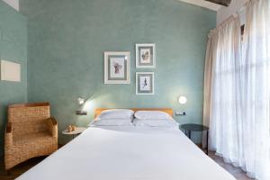 Postel nebo postele na pokoji v ubytování Hostal Pichorradicas