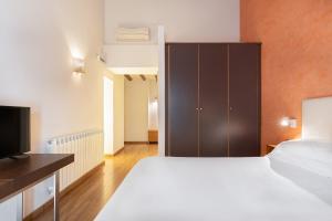 Postel nebo postele na pokoji v ubytování Hostal Pichorradicas