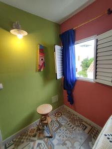 a small room with a chair and a window at Casa Mamre in Maspalomas