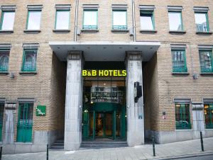 a large brick building with aba hotels sign on it at B&B HOTEL Brussels Centre Louise in Brussels