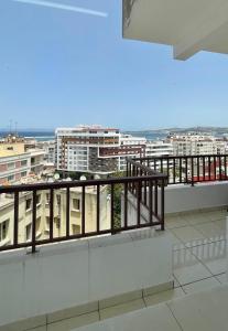 a balcony with a view of a city at Elegant and Panoramic 3-Bedroom in Central Tangier in Tangier