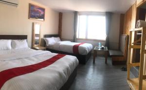 Letto o letti in una camera di Hotel Odaan