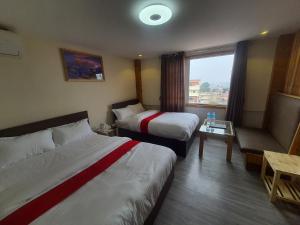 Letto o letti in una camera di Hotel Odaan