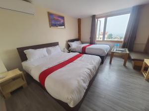 Letto o letti in una camera di Hotel Odaan