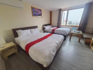 Letto o letti in una camera di Hotel Odaan