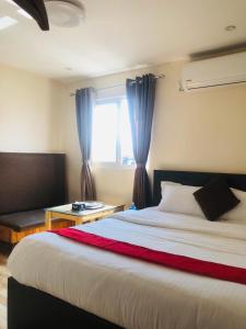 Letto o letti in una camera di Hotel Odaan
