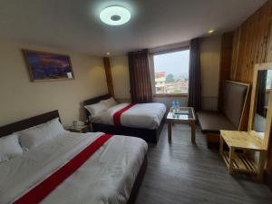Letto o letti in una camera di Hotel Odaan