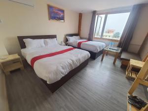 Letto o letti in una camera di Hotel Odaan