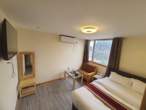 Letto o letti in una camera di Hotel Odaan
