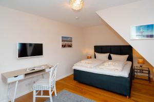 Ein Bett oder Betten in einem Zimmer der Unterkunft Ferienhaus Sprotte
