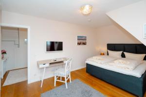 Ein Bett oder Betten in einem Zimmer der Unterkunft Ferienhaus Sprotte