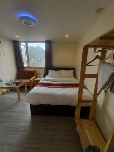 Postel nebo postele na pokoji v ubytování Hotel Odaan