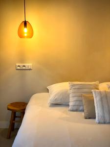 Säng eller sängar i ett rum på Felix - Maison d'hôtes