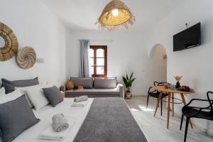 a living room with a couch and a table at Katerina Studios in Naxos Chora