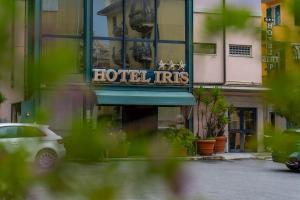a hotel hits sign on the front of a building at Hotel Iris in Genoa