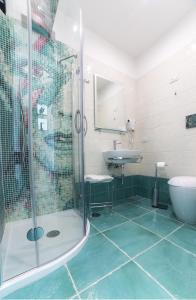 a bathroom with a shower and a sink at La Madegra Seasuite in Salerno