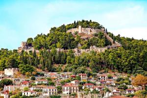 a castle on top of a hill with houses at Nafpaktos studio in port Ι in Nafpaktos