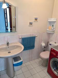 a bathroom with a sink and a toilet at Elegant and Panoramic 3-Bedroom in Central Tangier in Tangier