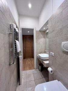 Koupelna v ubytování Maison Vaticana + 106 fotografií