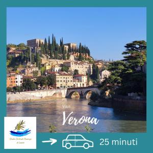 a picture of a town with a river and a bridge at Studio Centrale Pacengo di Lazise in Lazise
