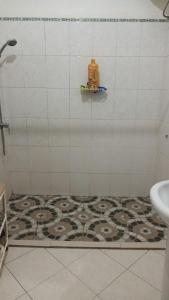 a bathroom with a shower with a tile floor at Casa Tota in Assomada