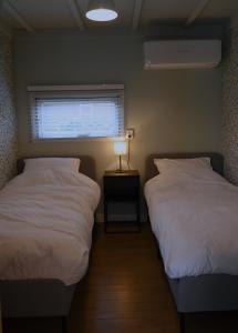 Llit o llits en una habitació de Quiet and spacious holiday home