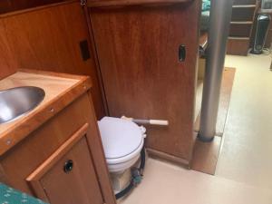 a bathroom with a toilet and a sink at Sailboat Experience in Annapolis in Annapolis