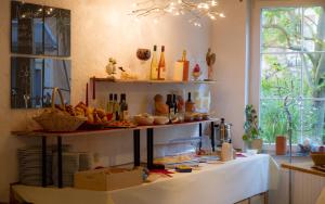 a kitchen with a counter with some food on it at Weingut Weinstube Weinhotel Wolf in Harxheim