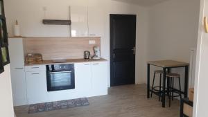 A cozinha ou kitchenette de Gîte Le Rocher