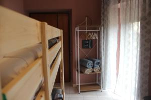 Palanda nebo palandy na pokoji v ubytování Casa Vacanze Sud e Magia