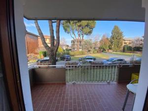 a view of a parking lot from a balcony at La terrazza con le biciclette a due passi dal lago in Arona +2 photos