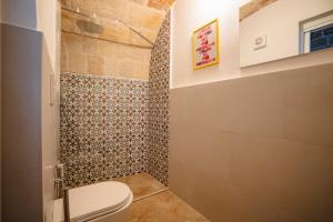a bathroom with a toilet and a shower at Casa Marina in Polignano a Mare