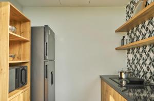 a kitchen with a stainless steel refrigerator at Champ Villa Long An in Ấp Bình Yên